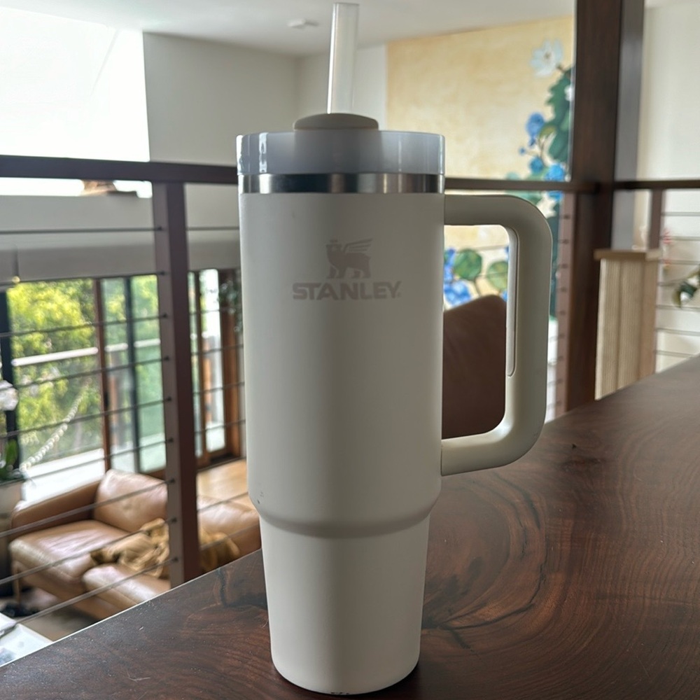 This is a slightly used Stanley water bottle, in the color cream.